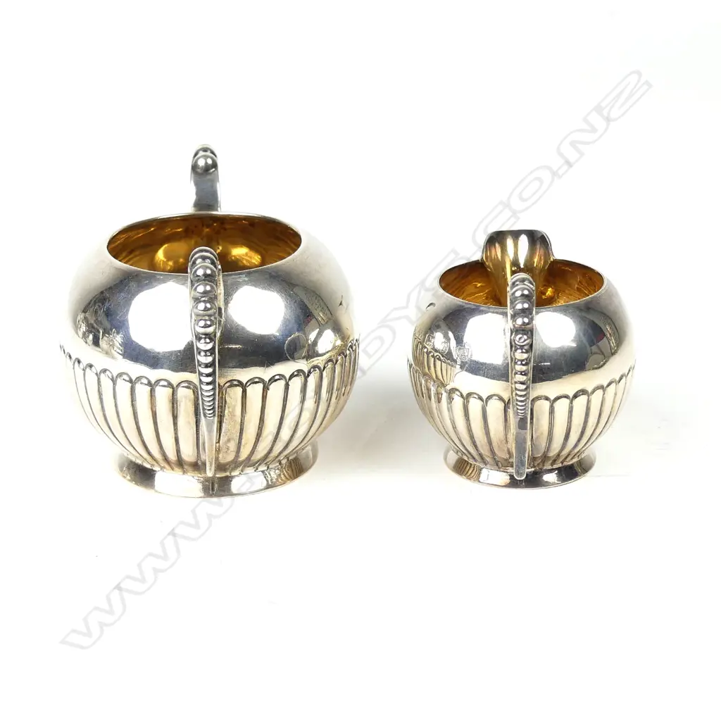A late Victorian silver cream and sugar Image 1++