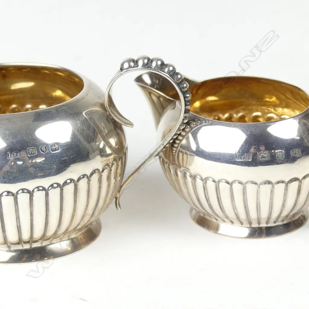 A late Victorian silver cream and sugar Image 1++