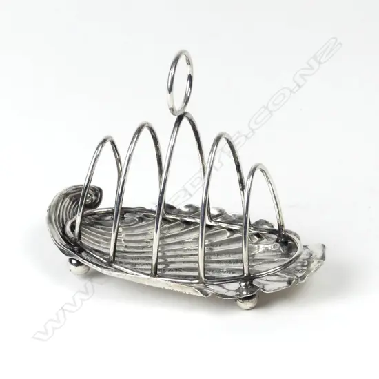 An Edwardian silver four-slice toast rack