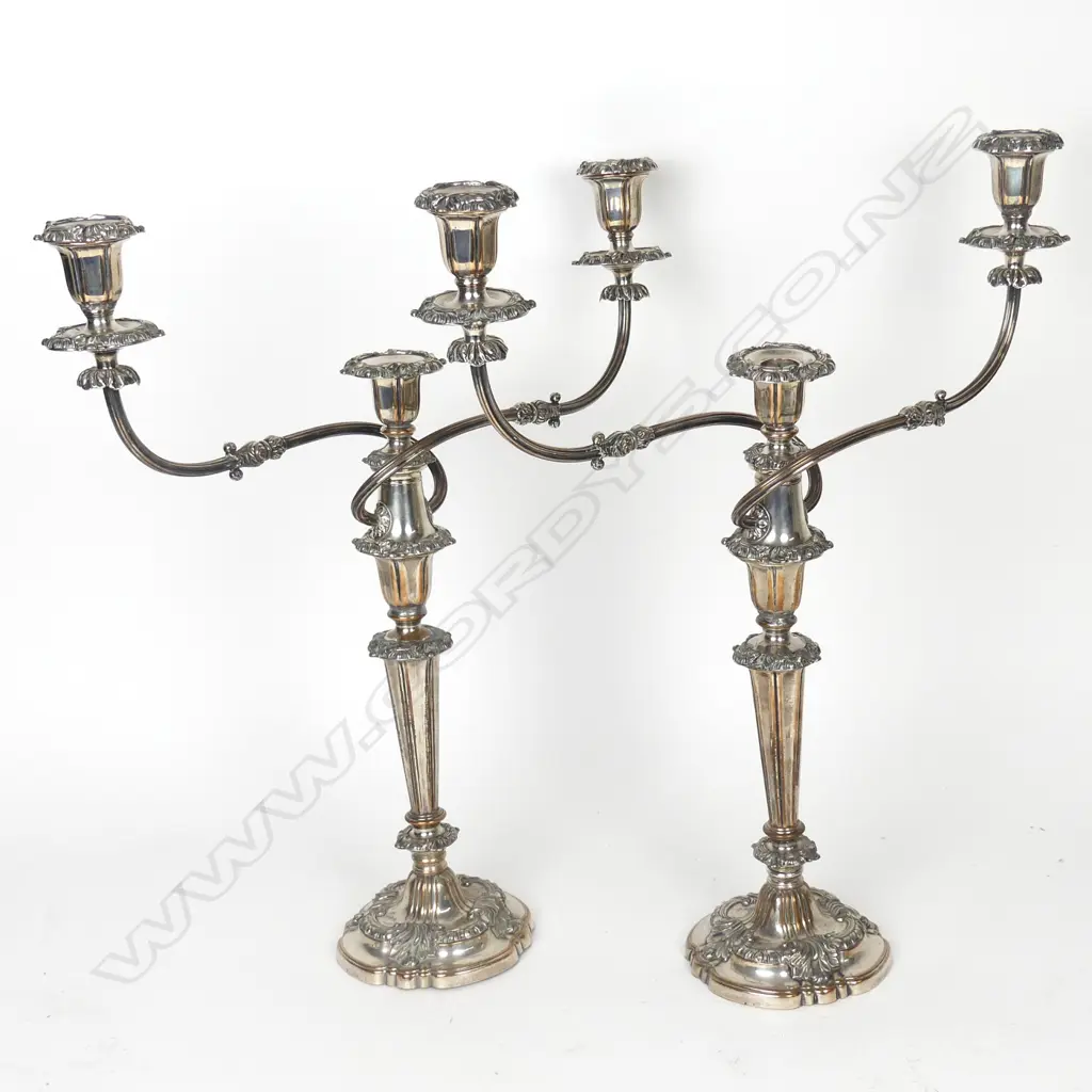 A pair of silver plate candelabra Image 1++