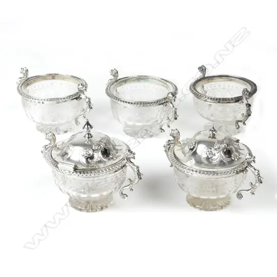 A Victorian silver and crystal condiment set