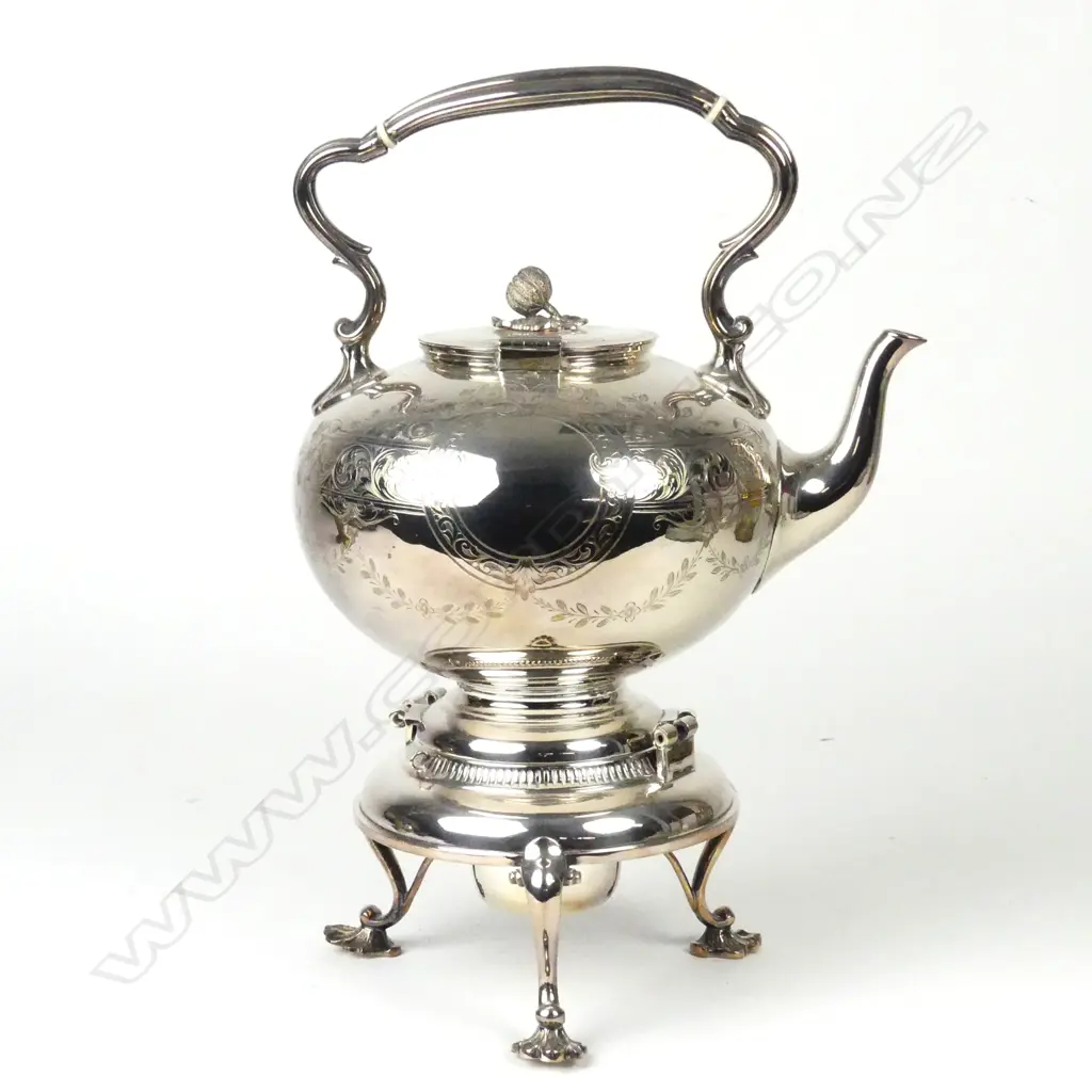 A Victorian silver plate spirit kettle Image 1++