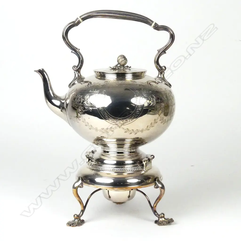 A Victorian silver plate spirit kettle Image 1++