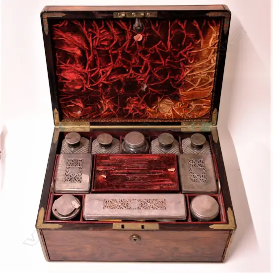 A George IV silver fitted rosewood travelling vanity box