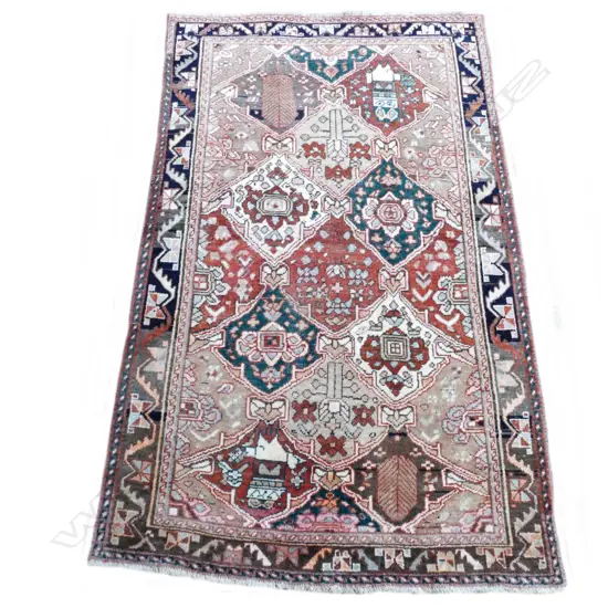 A hand knotted Shiraz rug