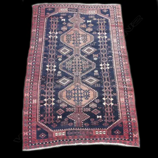 An antique Iranian hand knotted rug