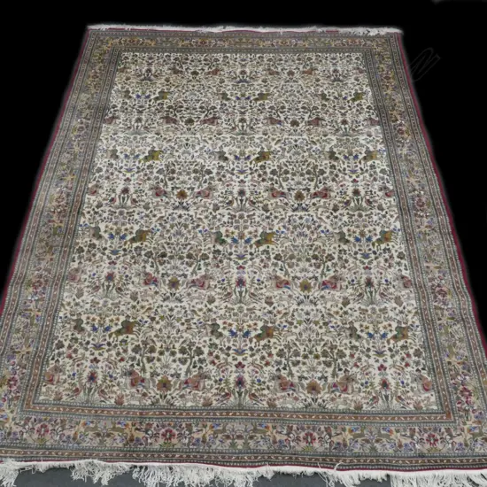A large hand knotted Iranian carpet