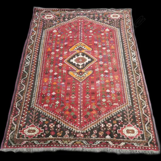 A hand knotted all wool Shiraz carpet