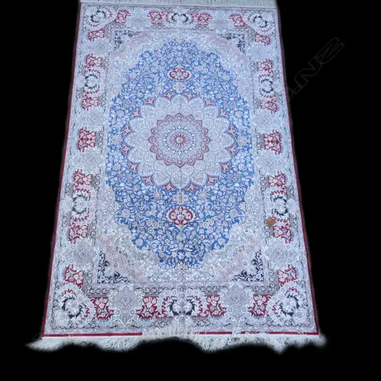 A fine silk pile and silk foundation hand knotted carpet