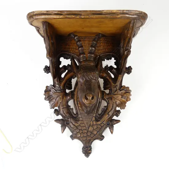 A 19thC Black Forest carved wooden wall sconce