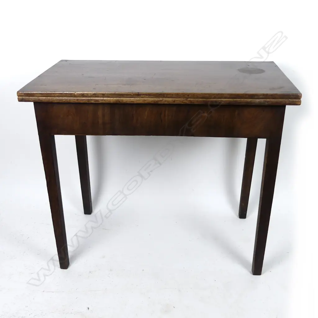 A Georgian mahogany fold over top tea table Image 1++