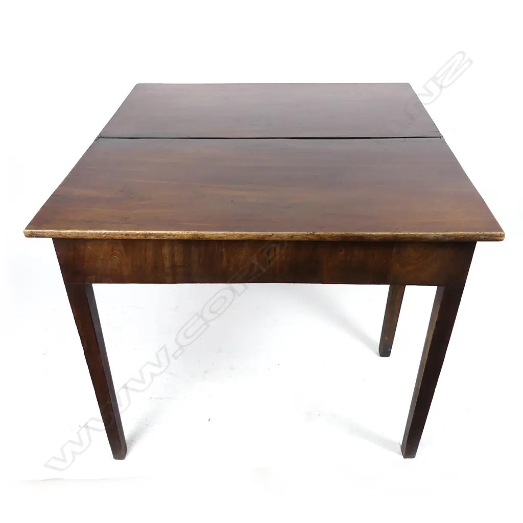 A Georgian mahogany fold over top tea table Image 1++