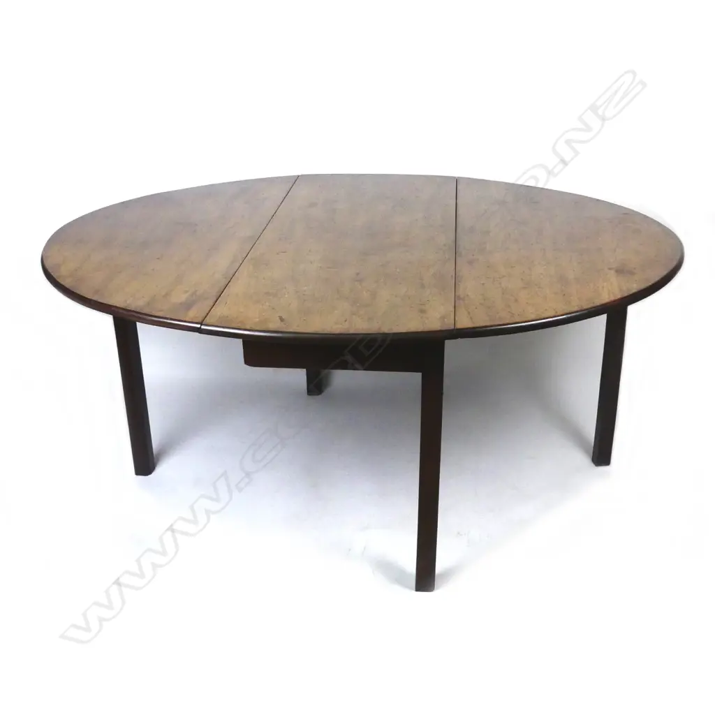 A Georgian mahogany dropside dining table Image 1++