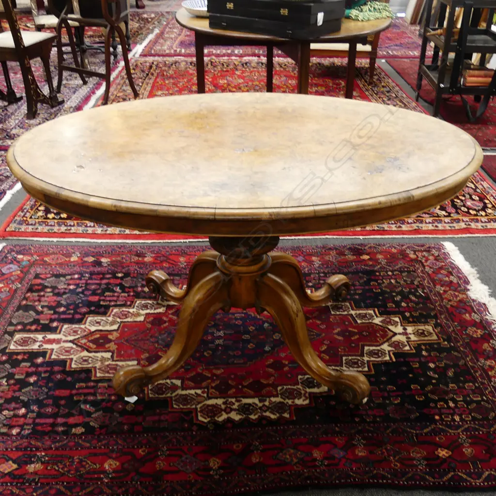 A Victorian burr walnut oval loo table Image 1++