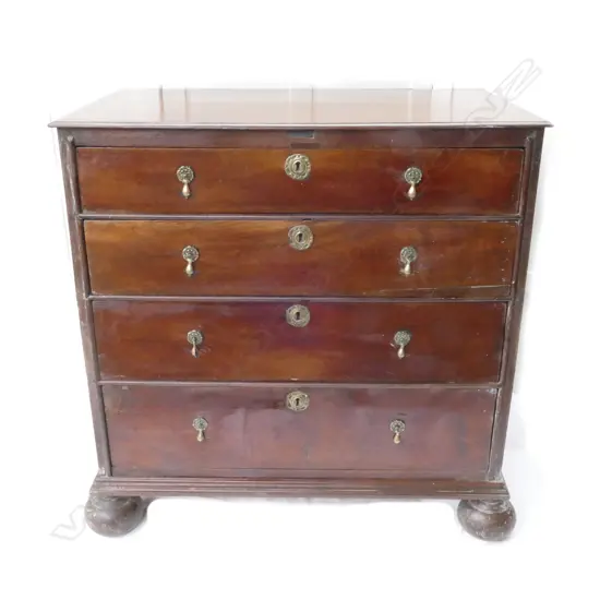 An oak flat-front five drawer chest