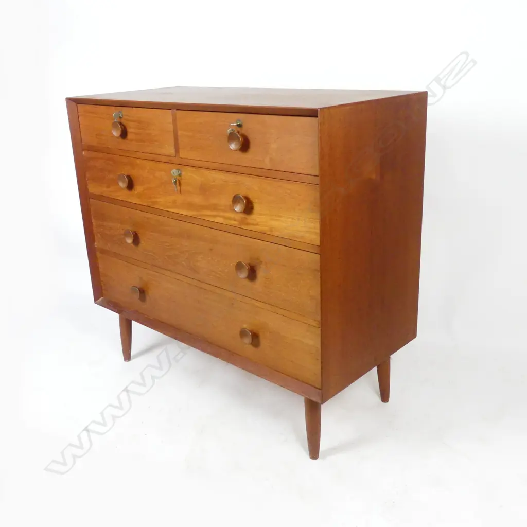 A mid-century chest of five drawers Image 1++