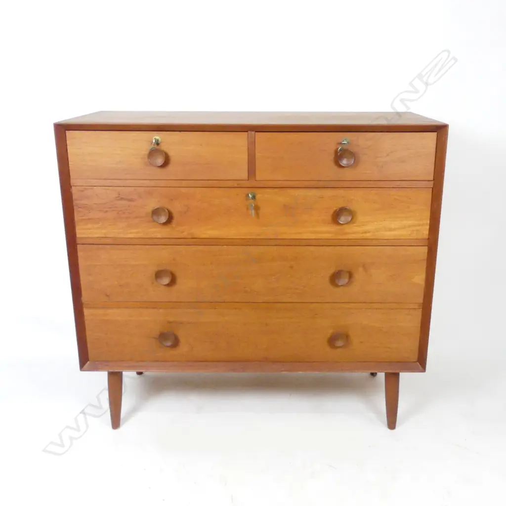 A mid-century chest of five drawers Image 1++