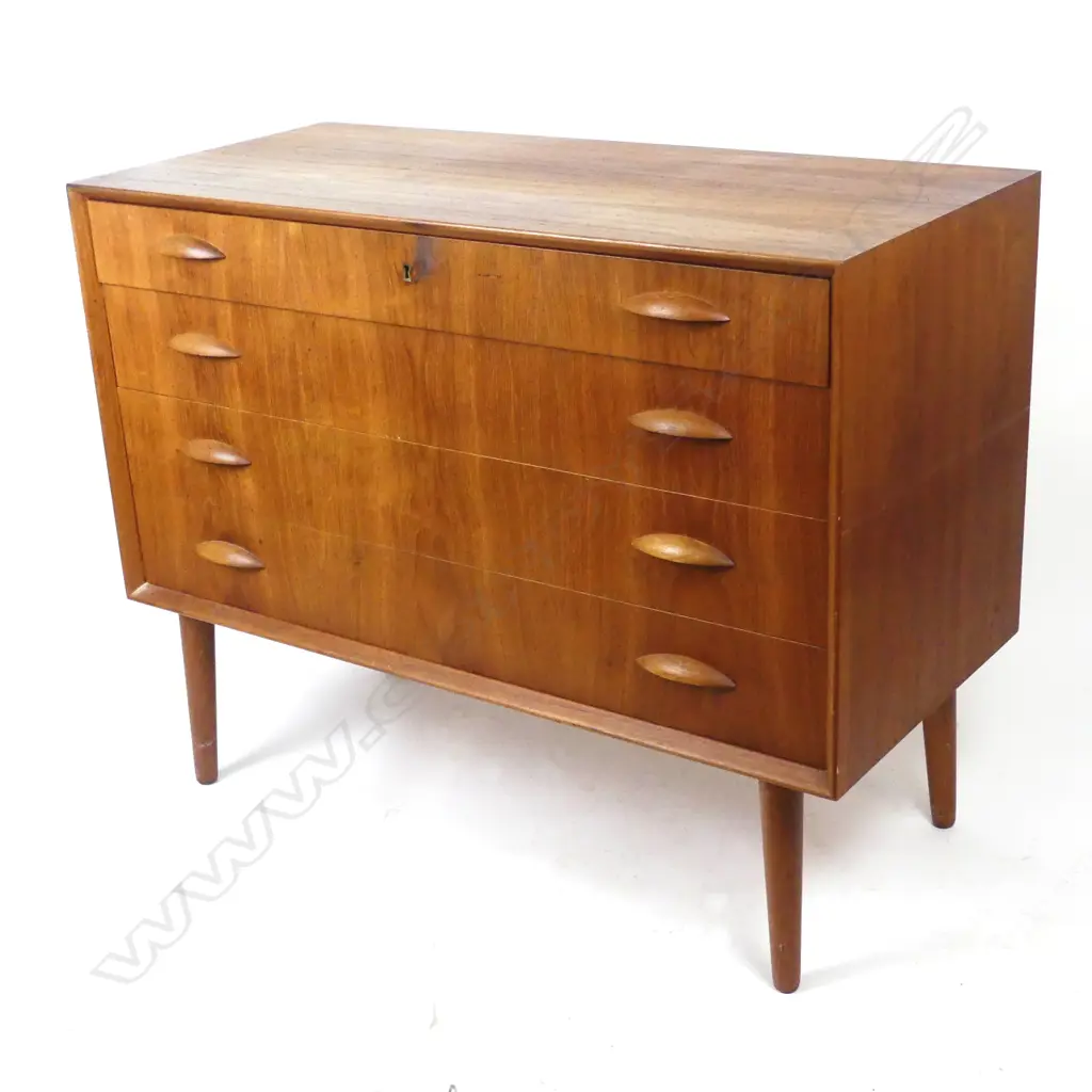 A Danish mid-century teak chest of four drawers Image 1++