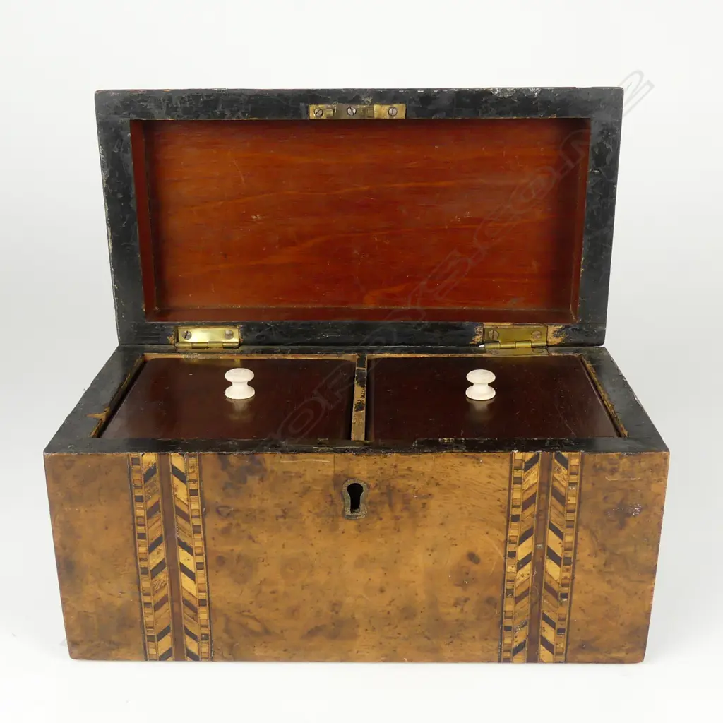 A Victorian walnut dome top tea caddy Image 1++