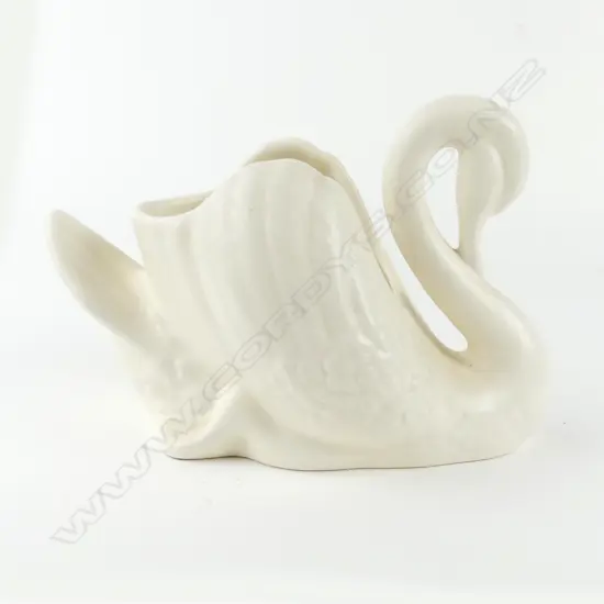 A small white Crown Lynn swan