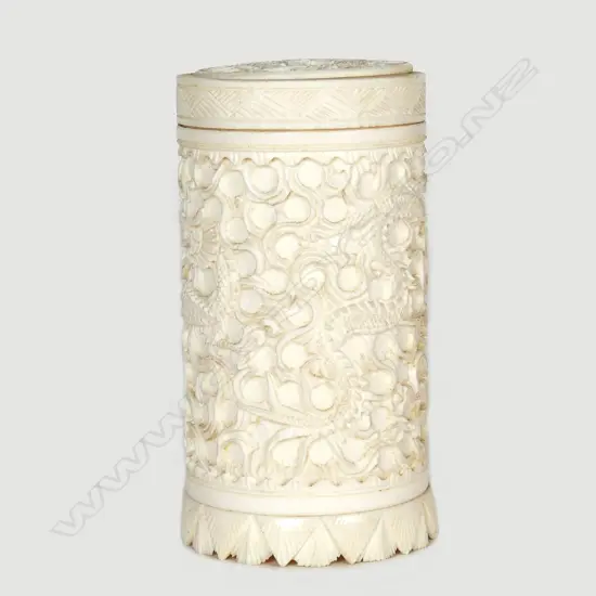 A Chinese carved ivory cylindrical box and cover
