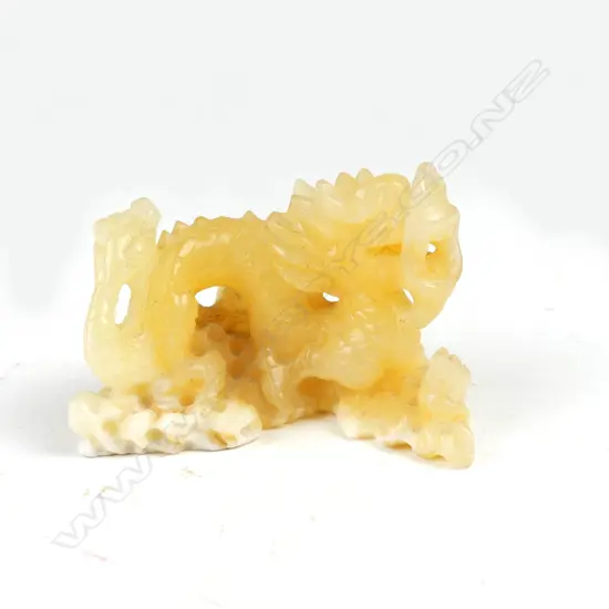An unusual pale yellow/white jade Chinese carving of a dragon