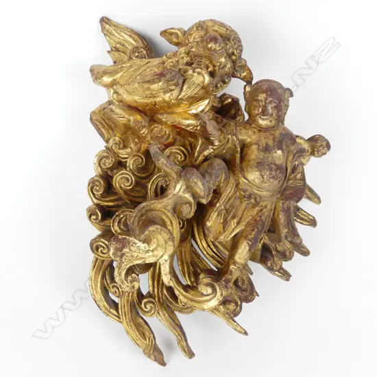 A decorative 19thC Chinese gilt wood carving