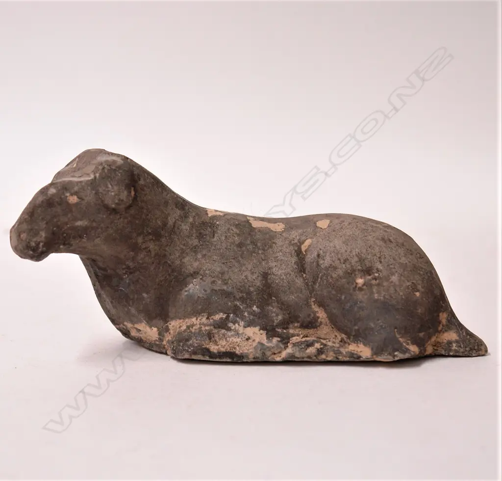 A Chinese reputedly Han Dynasty recumbent cow Image 1++