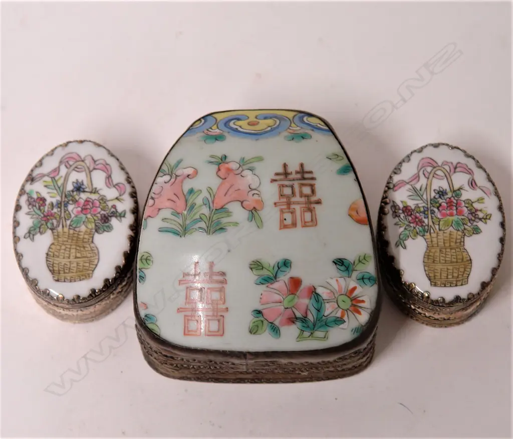 Three enamel painted porcelain panelled lidded boxes Image 1++