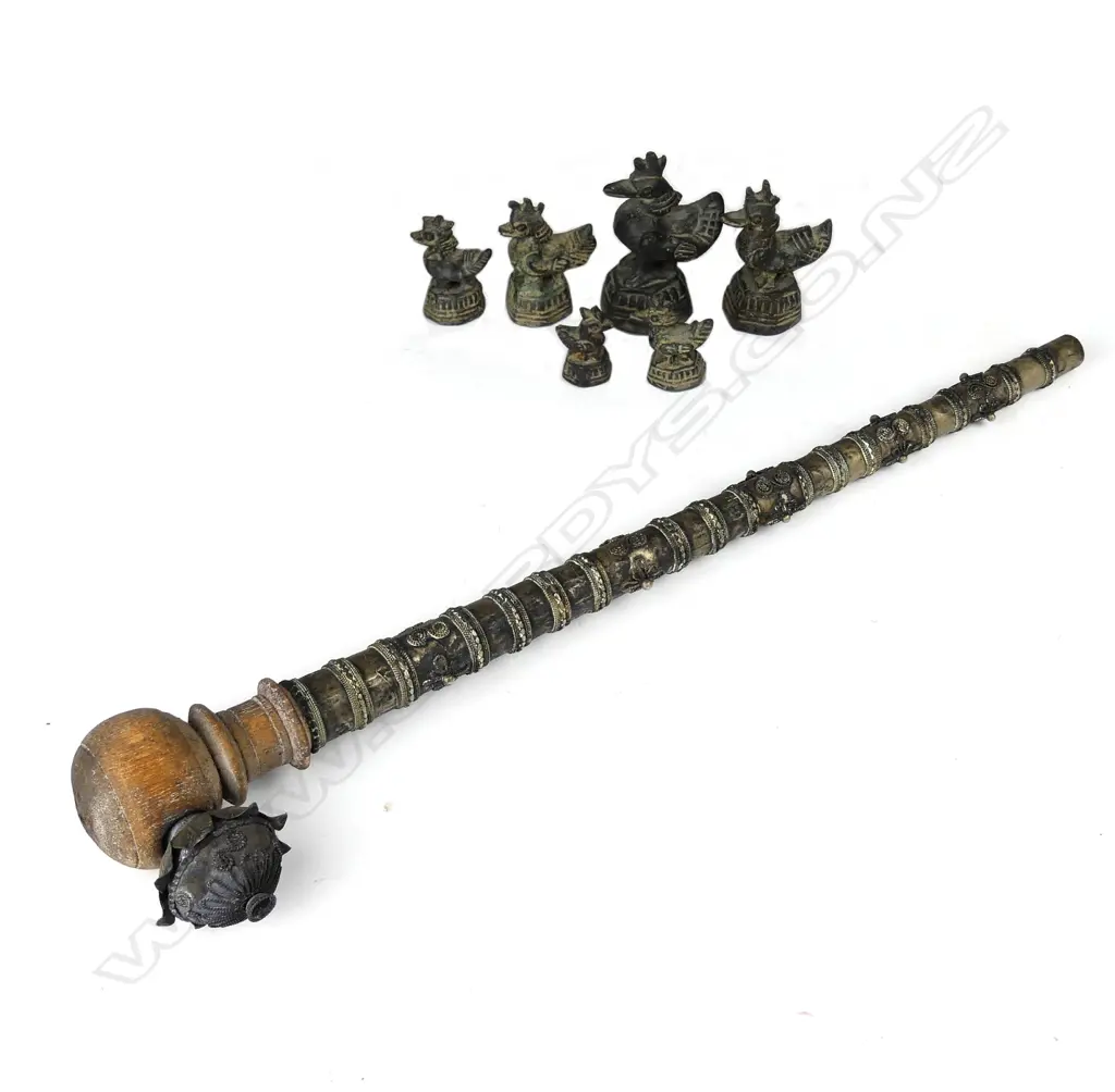 A set of eight opium weights and pipe Image 1++