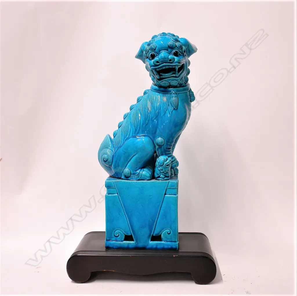 A Chinese large turquoise glaze seated foo dog Image 1++