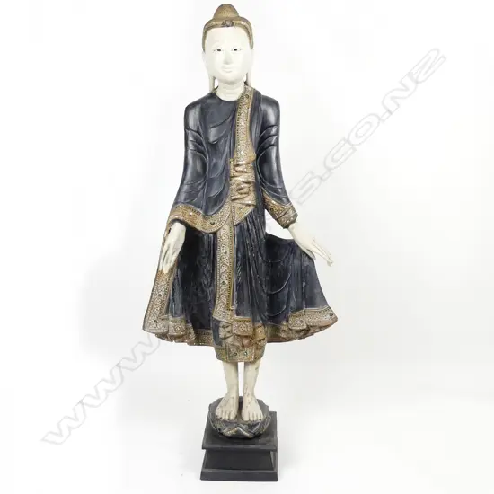 A wooden standing Buddha