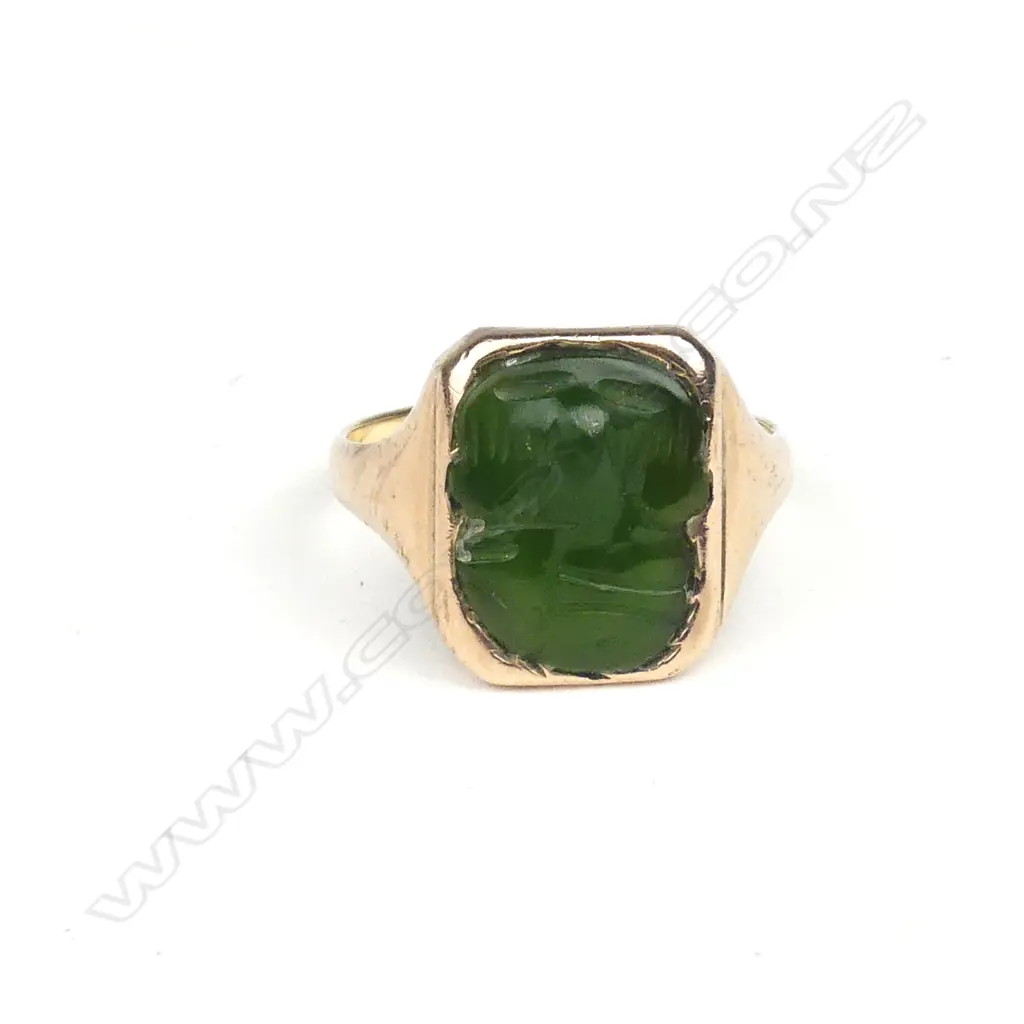 A 9ct. rose gold greenstone tiki mounted signet ring Image 1++