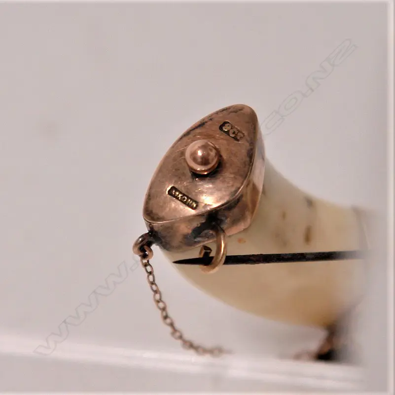 An Adolph Kohn 9ct. rose gold mounted boar's tusk brooch Image 1++