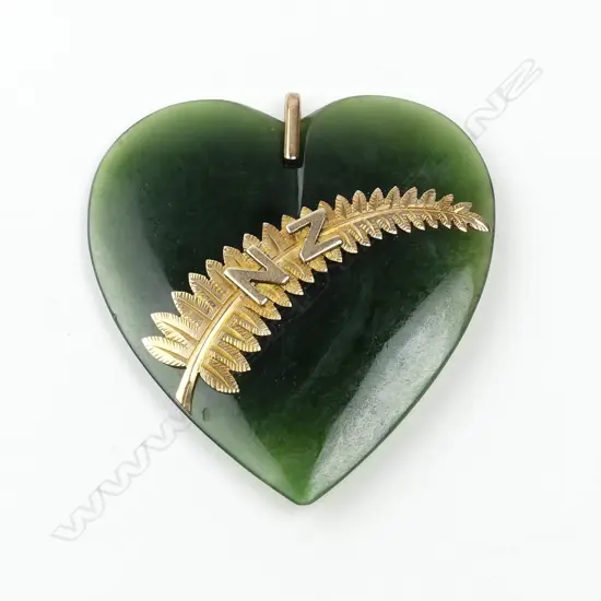 A c.1900 greenstone (nephrite) and gilded 9ct. rose gold mounted heart pendant