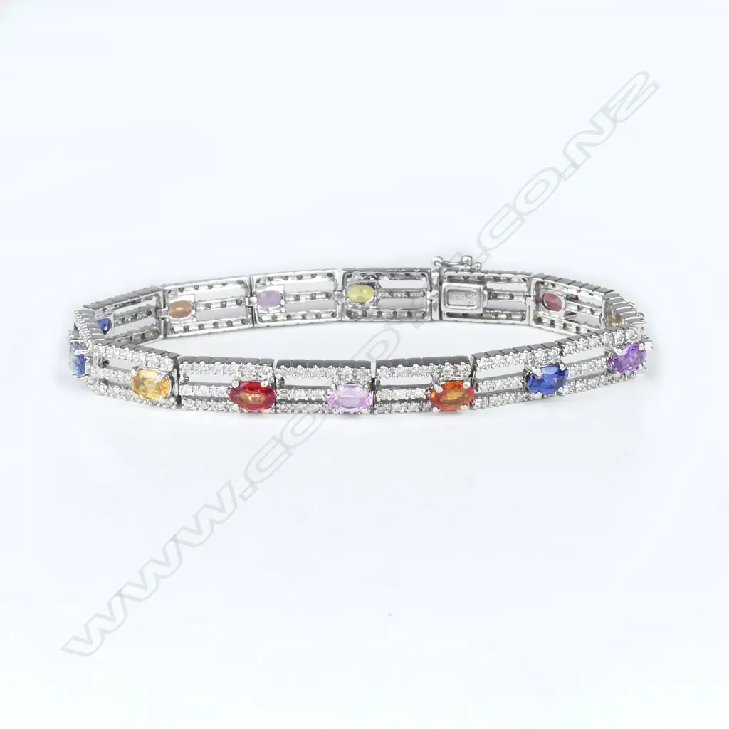 An 18ct white gold diamond and sapphire bracelet Image 1++