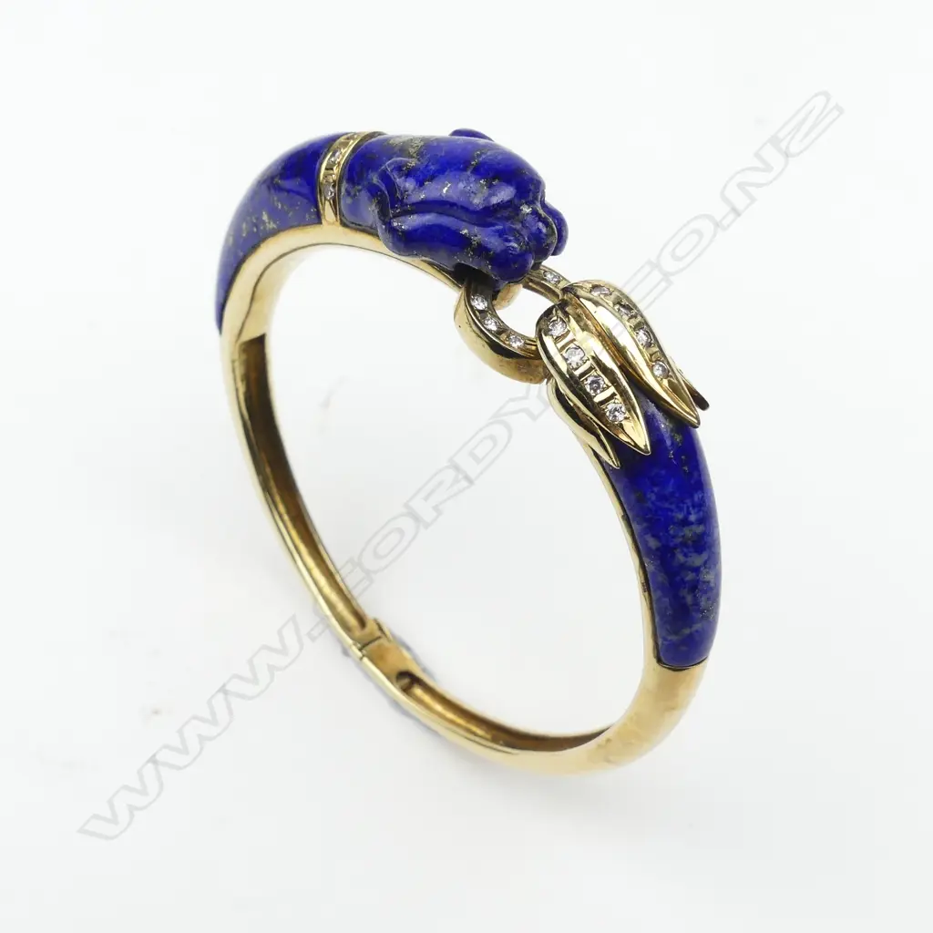 A 14ct gold lapis lazuli and diamond bangle in Cartier style Image 1++
