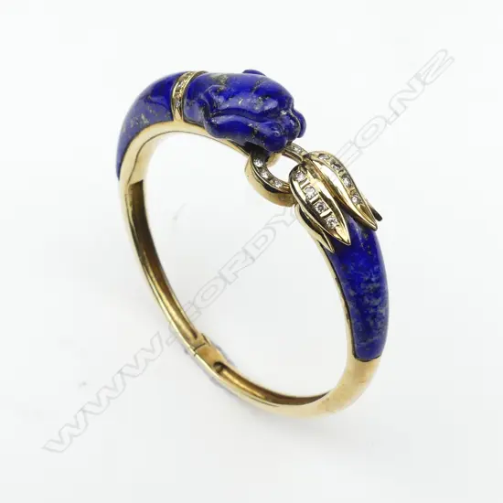 A 14ct gold lapis lazuli and diamond bangle in Cartier style