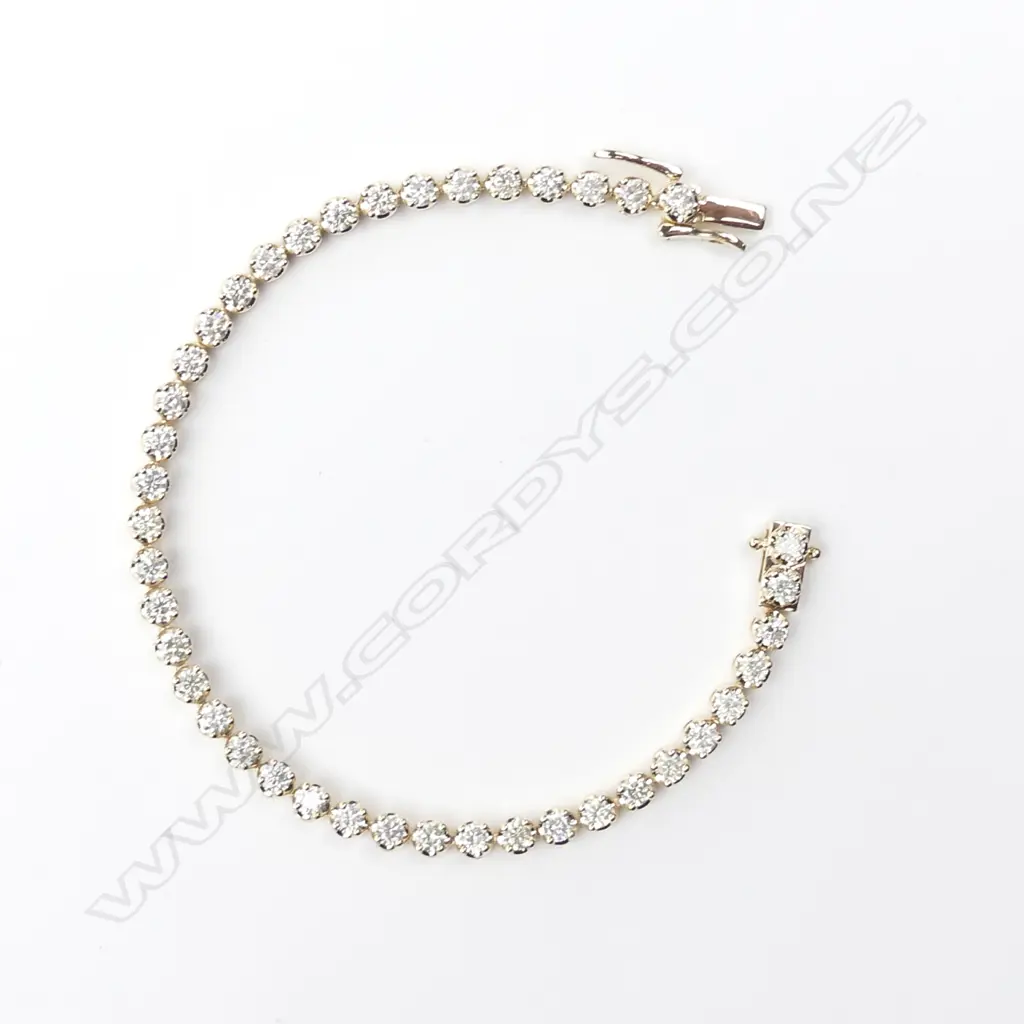 A 14ct yellow gold and diamond tennis bracelet Image 1++