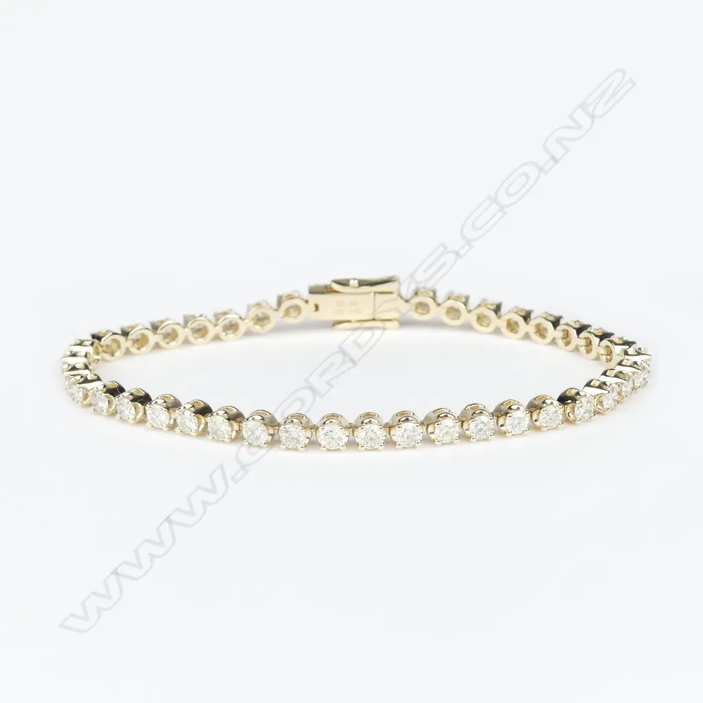 A 14ct yellow gold and diamond tennis bracelet Image 1++