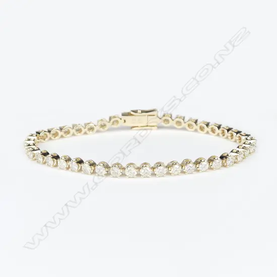 A 14ct yellow gold and diamond tennis bracelet