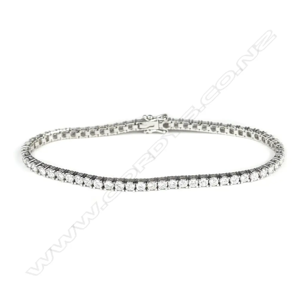 A lady's modern 18ct. white gold and multi-diamond tennis bracelet Image 1++