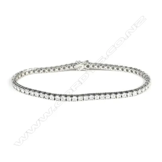 A lady's modern 18ct. white gold and multi-diamond tennis bracelet