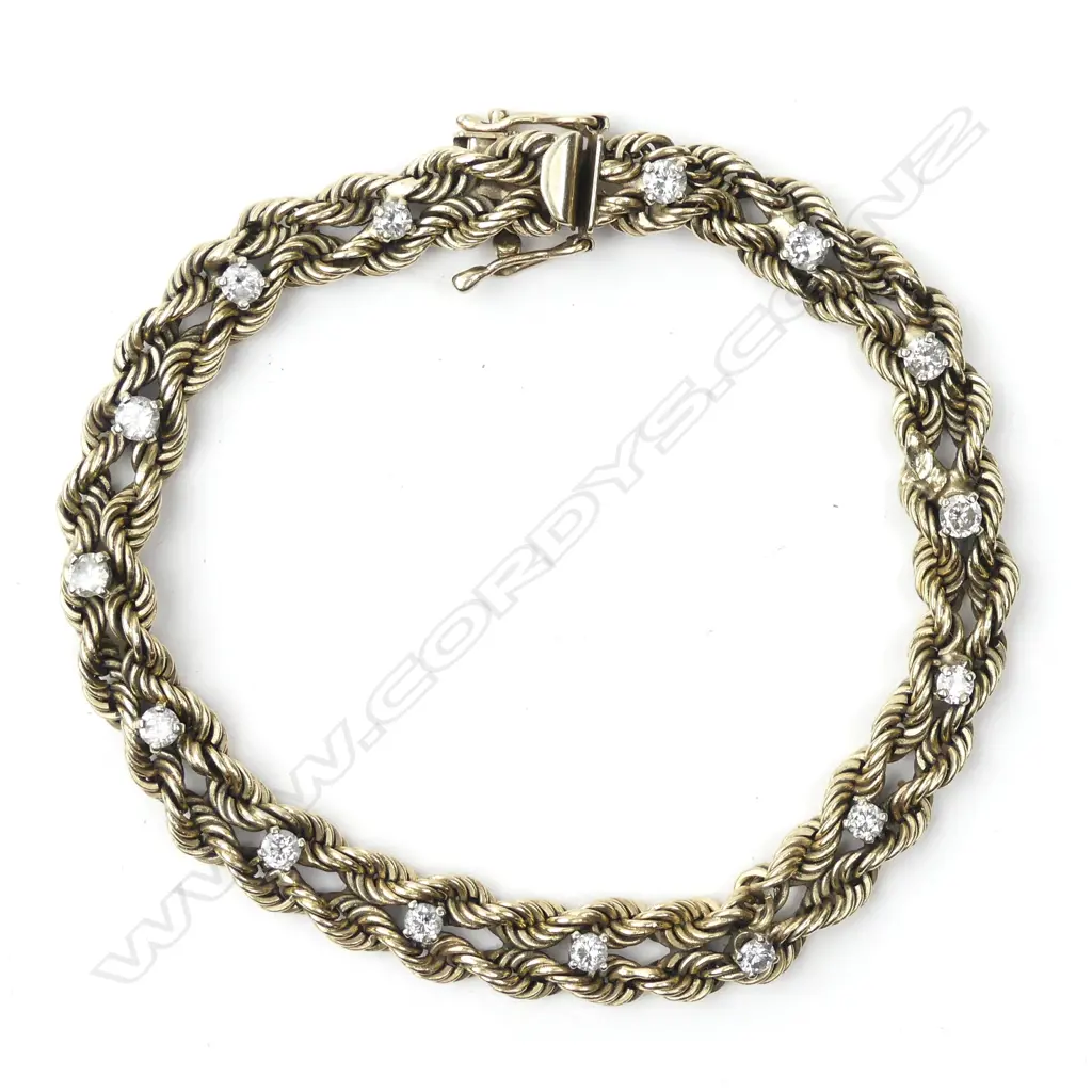 An estate 14ct. yellow gold and diamond bracelet Image 1++