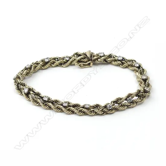 An estate 14ct. yellow gold and diamond bracelet