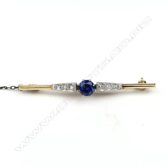 An 18ct gold platinum sapphire and diamond bar brooch