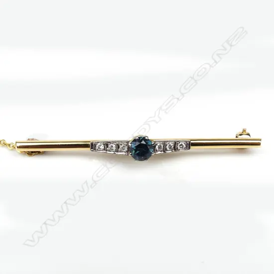 An 18ct yellow and white gold sapphire and diamond bar brooch