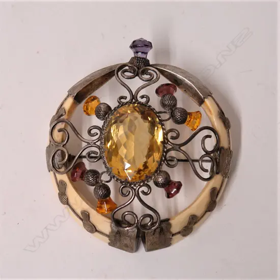 An impressive early 1900s Scottish silver and boar's tusk brooch