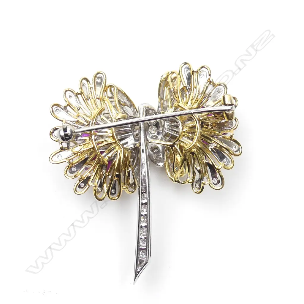An 18ct yellow and white gold diamond and ruby brooch Image 1++