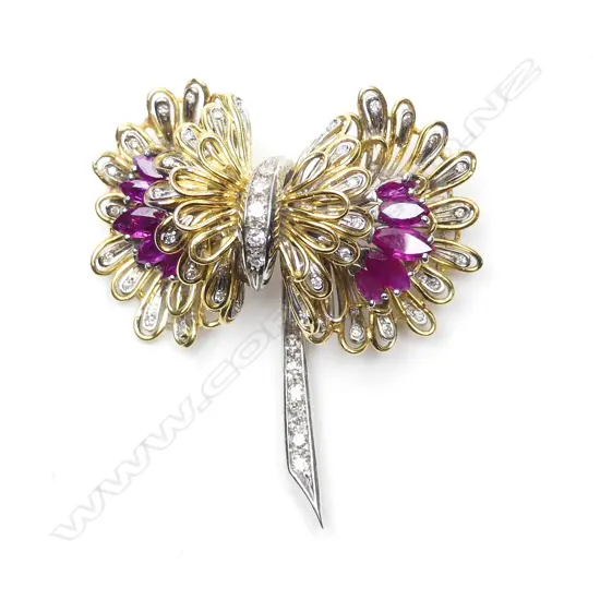 An 18ct yellow and white gold diamond and ruby brooch
